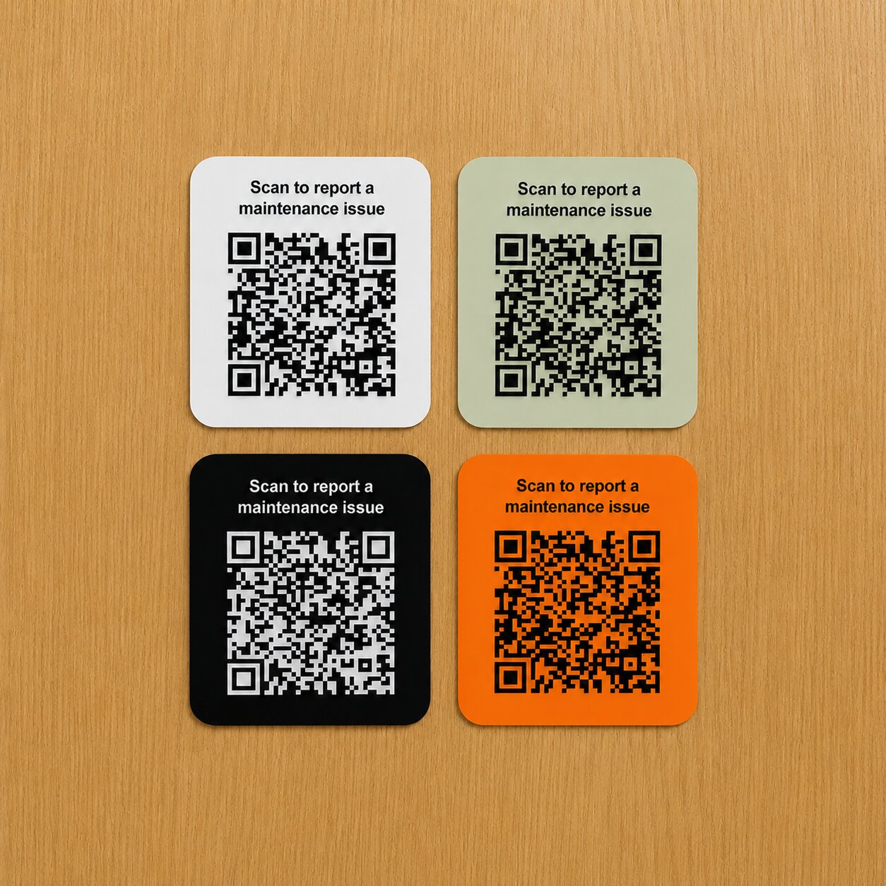 Maintenance QR boards displayed on a wooden background.